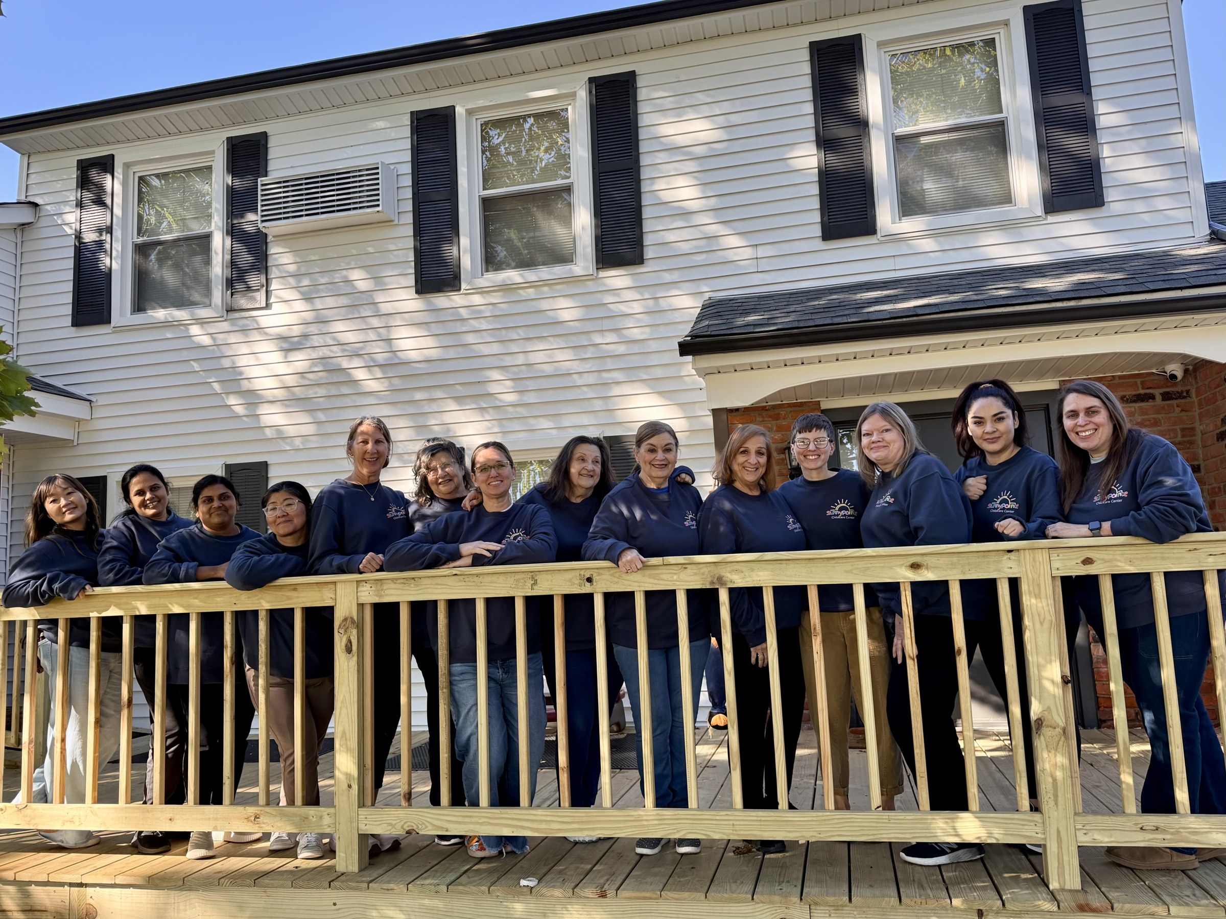 The Sunny Pointe Childcare Center teaching team outside our Northville building